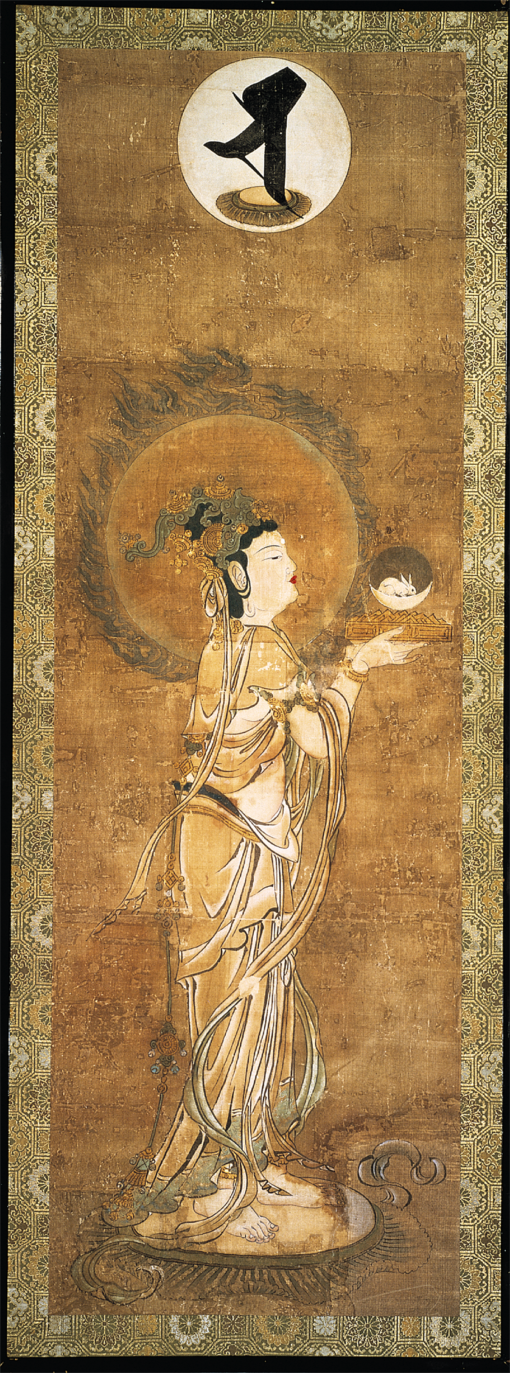 The Japanese Buddhist Moon-goddess Gwatten, whose head is haloed by the Full Moon, holds in her hands a basket, upon which rests a crescent Moon against a dark disc, with a white hare sitting inside it. Part of a Sung style Japanese Buddhist painting, by Takuma Shoga, Koy’ogokukuji Temple Museum, Kyoto. 1191 AD.